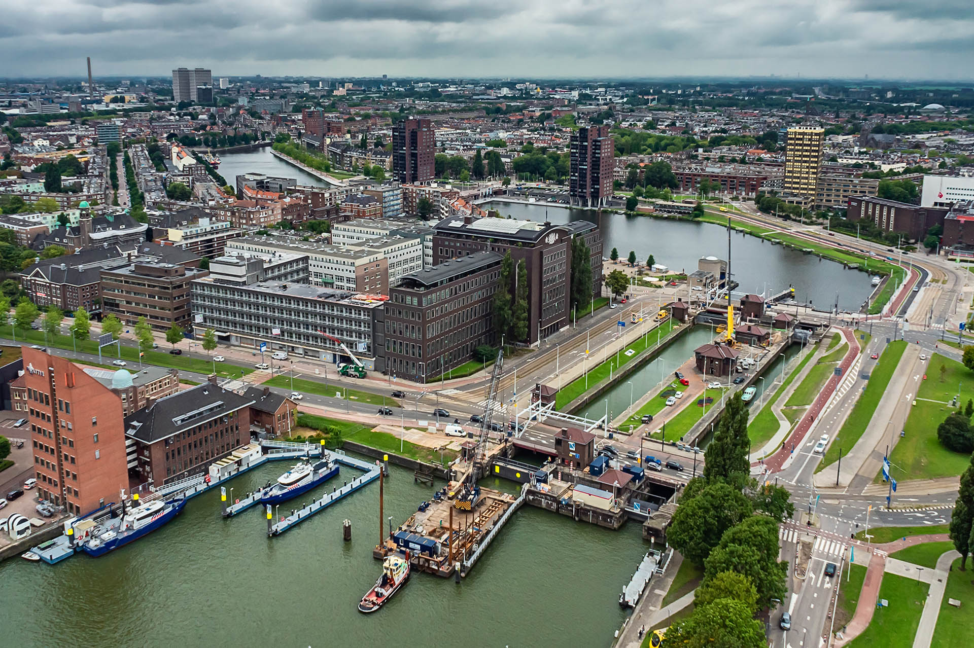 Aerial view shot of Rotterdam city in the Netherlands https://argorefinedgroup.com/wp-content/uploads/2025/10/aerial-view-shot-rotterdam-city-netherlands-1.jpg